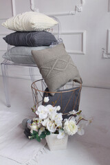 Beautiful knitted light pillows and balls of thread for knitting