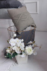 Beautiful knitted light pillows and balls of thread for knitting