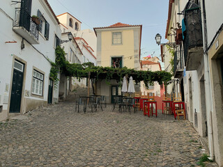 Small square in the Alfama district in Lisbon, Portugal - obrazy, fototapety, plakaty
