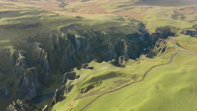 A green canyon with a blue river. Fjadrargljufur canyon in Iceland #6.