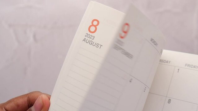 slow motion of a turning page of a calendar 