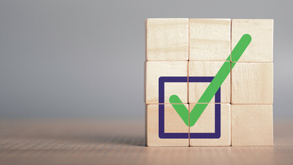 Quality certification and ISO symbol in wood cube with checkmark icon. Ethical corporate. Do the...