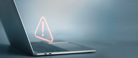 Triangle caution warning sign on laptop screen and Businessman or it staff , programmer, developer...