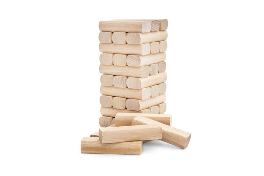 Wooden tower from wooden blocks on white.