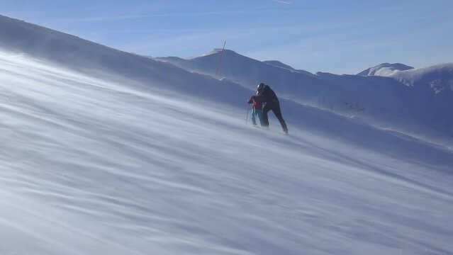 Dad and Son on the Ski Slope. Slow Motion