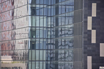 colorful  glass windows of a skyscraper , working life in plaza	