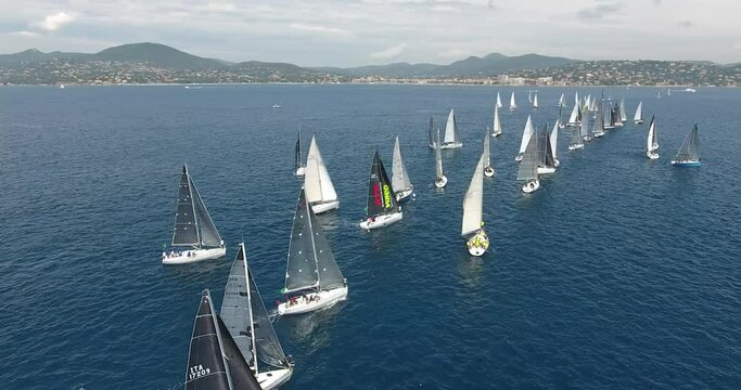 aerial view start of the Rolex Giraglia 2019 regatta, many sailing yachts have started and are making maneuvers