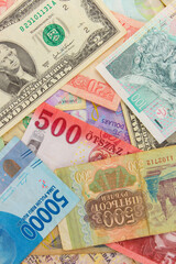 Fototapeta na wymiar Background from different money banknotes from all over the world