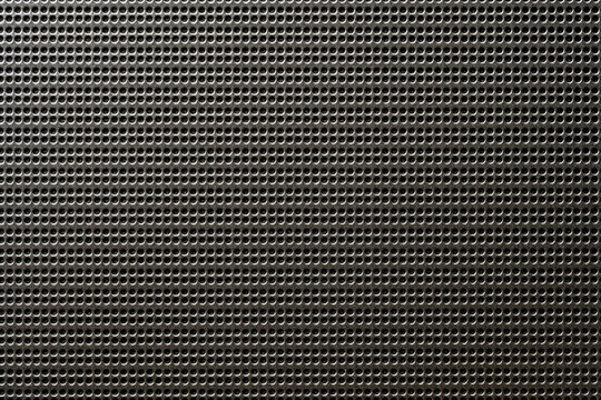 Black speaker lattice background or texture, closeup. Abstract metallic mesh texture pattern for background