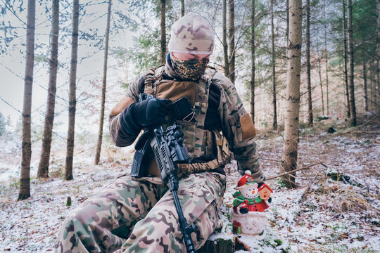 soldier with christmas decoration. The season of Christmas in a time of war