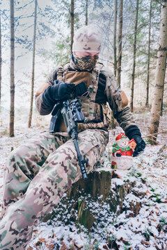 soldier with christmas decoration. The season of Christmas in a time of war