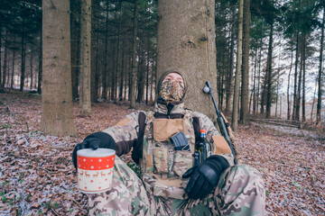 Soldier drinks Christmas punch. A moment of peace at Christmas in a war zone