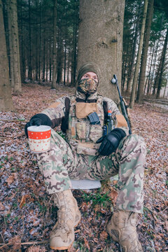 Soldier drinks Christmas punch. A moment of peace at Christmas in a war zone