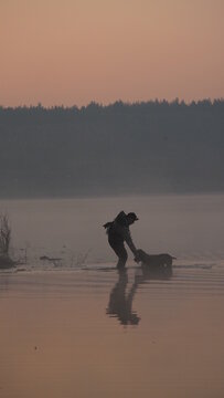 hunting by the creek in the forest. And hunting birds. Hunter hunting at sunrise