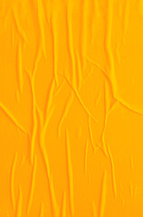 Abstract poster with crumpled wet paper texture on a yellow or orange background