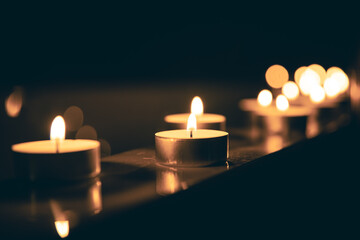 Burning candles in the bathroom in the dark.