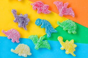 Dinosaurs colorful jelly bonn, color background