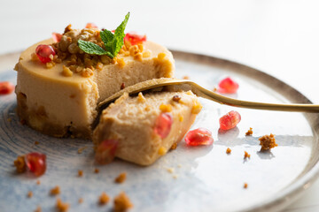 Cheesecake and almond nougat. Typical Christmas dessert served on a table with Christmas...