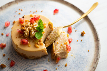 Cheesecake and almond nougat. Typical Christmas dessert served on a table with Christmas decorations.