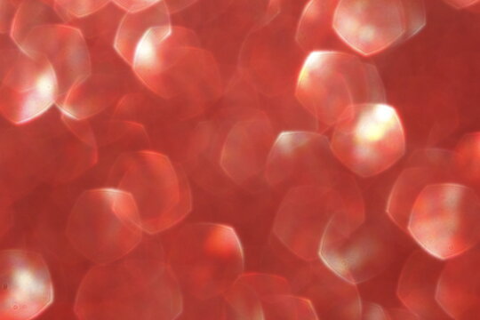 Fototapeta Elegant and abstract red glowing bokeh background. Seasonal light decorative abstract design element.