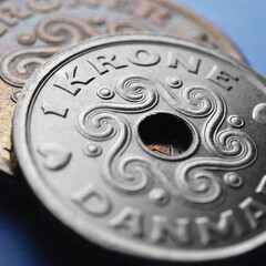 Danish coins. 1 Danish krone coin closeup. National currency of Denmark. Money square illustration for news about economy or finance. Loan and credit. Tax and inflation. Macro
