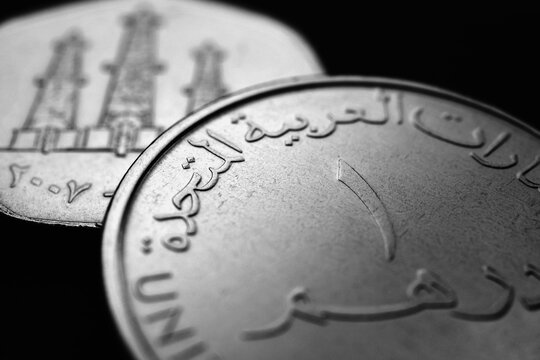 Translation: 1 one dirham United Arab Emirates. UAE coins close up. Currency of  Emirates. Black and white money illustration. News about UAE dirham. AED. Banking and credit. Wages and taxes. Macro