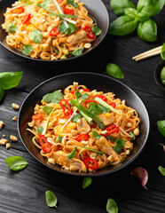 Chicken Pad Thai with eggs, bean sprouts, peanuts and spring onion