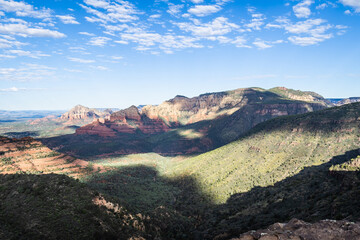 The red rocks, green valleys, and blue skies of a morning over the city of Sedona, Arizona in early fall.