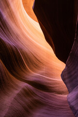 Details of the sandstone formations of Antelope canyon in Arizona with various hues of colors.
