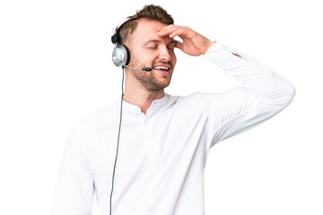 Telemarketer caucasian man working with a headset over isolated chroma key background has realized something and intending the solution