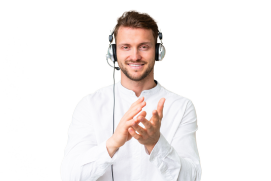 Telemarketer caucasian man working with a headset over isolated chroma key background applauding after presentation in a conference