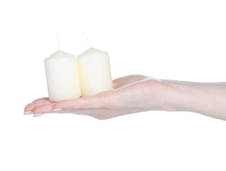 White candles light in hand on white background isolated. Christmas decor