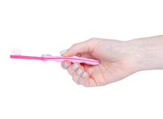 Children's pink toothbrush in hand on white background isolation