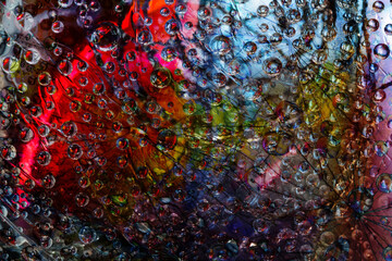 Space abstraction. Striped spheres are located against the multicolored background with black web silhouette. 3D render. 