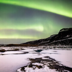 Fototapeta na wymiar northern lights above snowy icy iceland landscape
