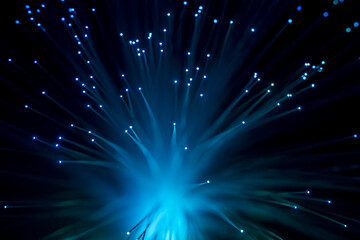 Background with sparkles of blue optical fibers