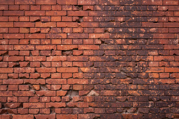 Fototapeta premium Red brick wall with holes from shots in the Brest Fortress.