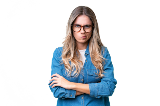Young Uruguayan woman over isolated background with unhappy expression