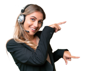 Telemarketer pretty Uruguayan woman working with a headset over isolated background pointing finger to the side and presenting a product
