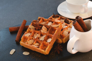 Warm  Belgian waffles with almonds, decorated almond chips , anise stars and cinnamon sticks.