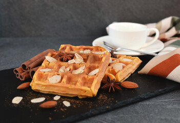 Warm  Belgian waffles with almonds, decorated almond chips , anise stars and cinnamon sticks.