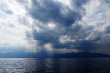 Approaching by boat the Yakushima Island in the south part of Kyushu, silhouette of Yakushima visible in the background