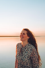 Obraz premium Portrait happy laughing woman in pink dress