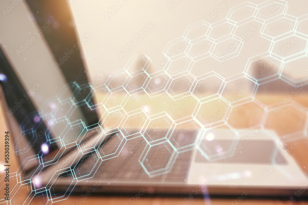 Poster double exposure of technology hologram with hexagon on laptop background. research and development s