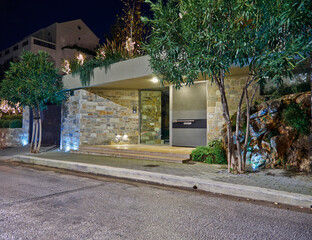A night view of a contemporary house Christmas decorated entrance. Athens, Greece..