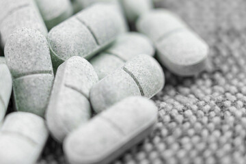 Tryptophan sedative pills on rough cloth