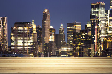 Blank table top made of wooden planks with beautiful New York cityscape at night on background, mockup