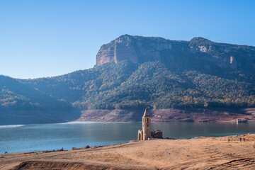 Sau's bell tower is completely uncovered due to the lack of water in the swamp. Lack of rain, drought, soil desertification, climate change, environmental problems.
