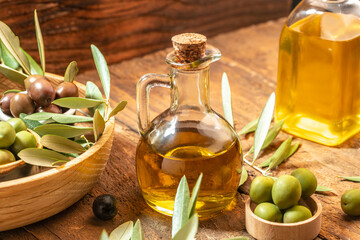 green olives with olive oil. extra virgin olive oil jars on a wooden background. place for text