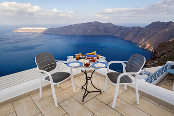 Fototapeta na wymiar Breakfast table for two on a high terrace